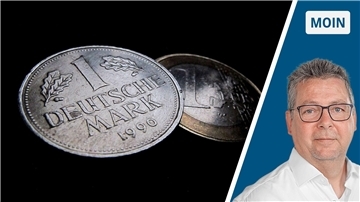 Ein 1-DM-Geldstück und ein-1-Euro-Geldstück