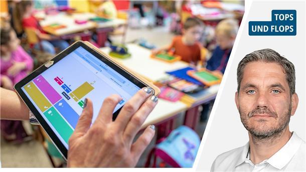 Eine Lehrerin benutzt ein Tablet in einer Schulklasse