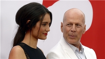 Bruce Willis und Emma Heming-Willis bei der Premiere des Films „Red 2“ 2013.