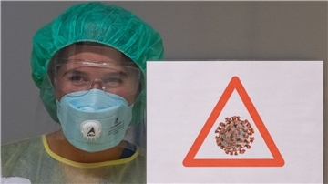 Eine Gesundheits- und Krankenpflegerin in einer Corona-Station. Mit der hohen Zahl der Neuinfektionen steigt auch die Belastung in den Krankenhäusern.