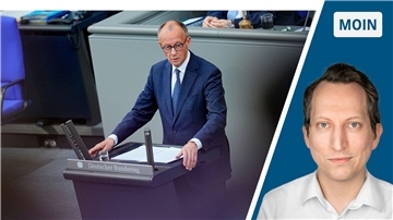 In der linken Hälfte des Bildes ist Friedrich Merz zu sehen. In der rechten Drittel des Bildes ist der Kopf des Autors zu sehen. Er trägt ein weißes Hemd. 
